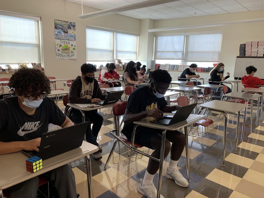 Students in Nicole Wrights English 3 class work quietly on a group project.  As more and more work moves into digital platforms, talking begins to look different, sometimes showing up as comments on a Google doc rather than as verbal discussion. 