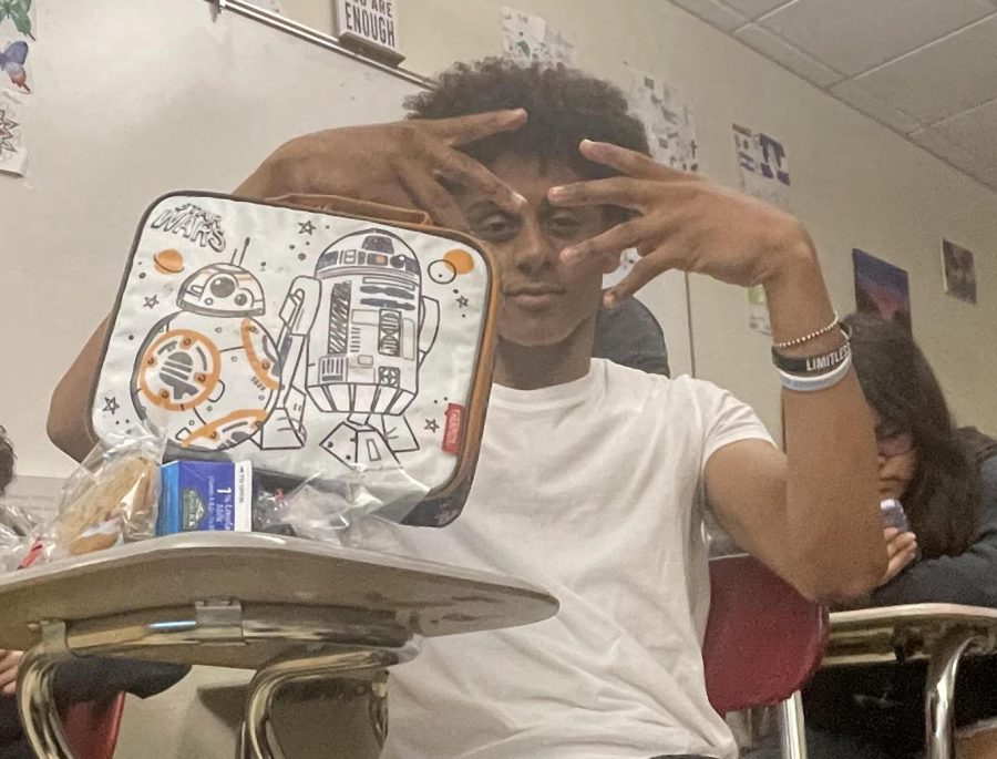 Freshman Adrian Reyes is one of several students at EHS trying to make some extra money pursuing their own small business.  Reyes involves selling snacks out of his special Star Wars lunchbox and is recognized by many, many students around the building.