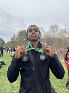 Multiple school record holder Kayshaun Eveillard shows off hardware from the 400-meter and 4x100 relay races at the April 25 meet.