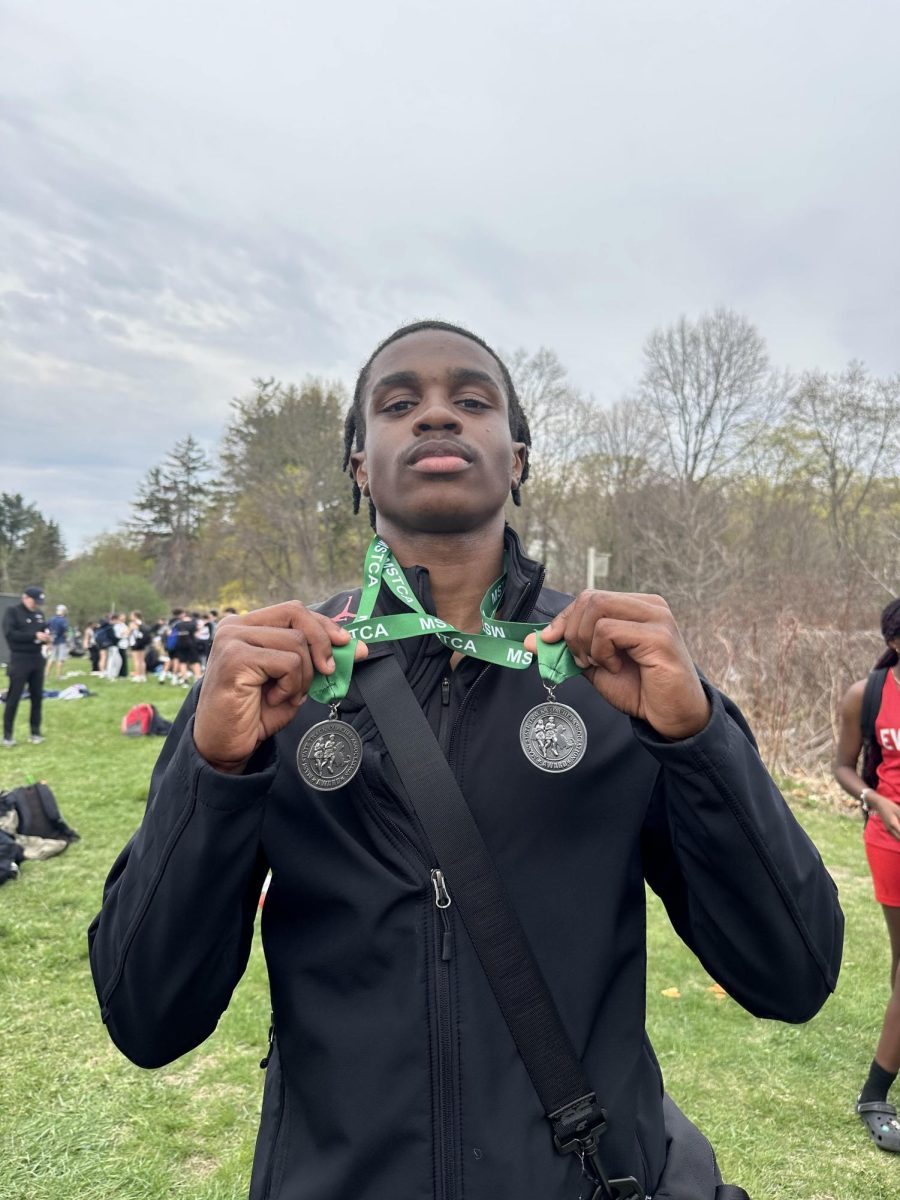 Multiple school record holder Kayshaun Eveillard shows off hardware from the 400-meter and 4x100 relay races at the April 25 meet.