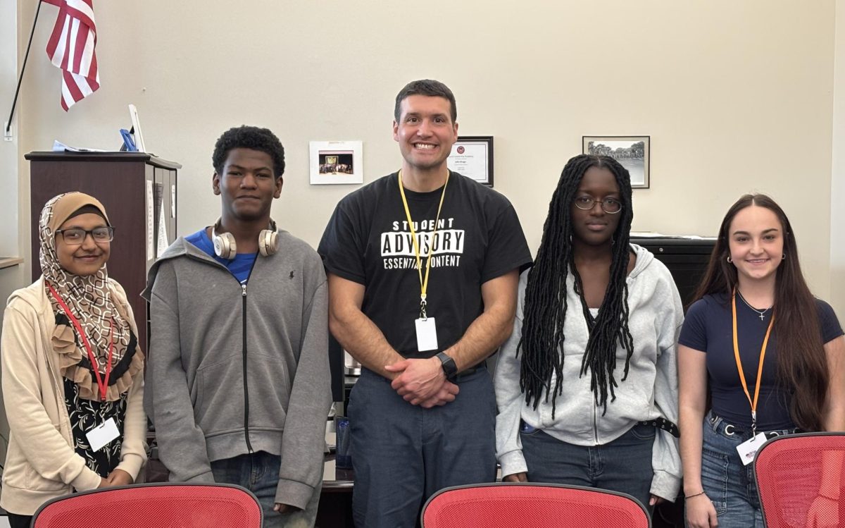From left: Susana Prachi '29, Adonis Brice '28, Principal John Braga, Anne-Laurie Elescar '28, Emma Perry '26