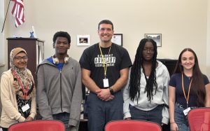 From left: Susana Prachi '29, Adonis Brice '28, Principal John Braga, Anne-Laurie Elescar '28, Emma Perry '26