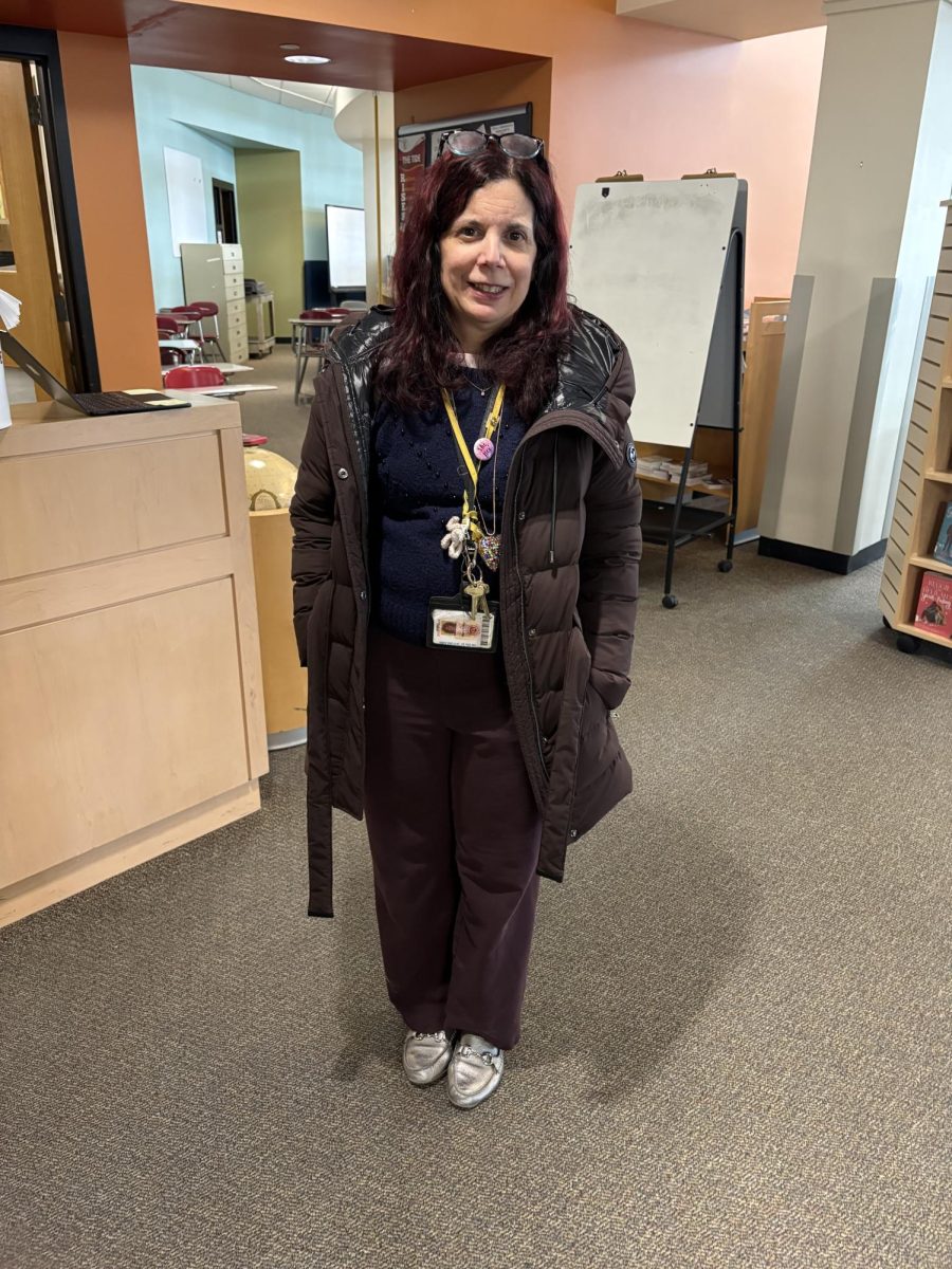 Librarian Mary Puleo poses in her Michael Kors jacket.