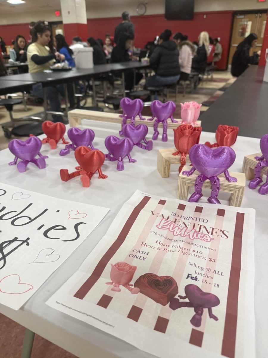 The advanced manufacturing class is selling 3D printed figurines in the cafeteria for Valentine's Day. 