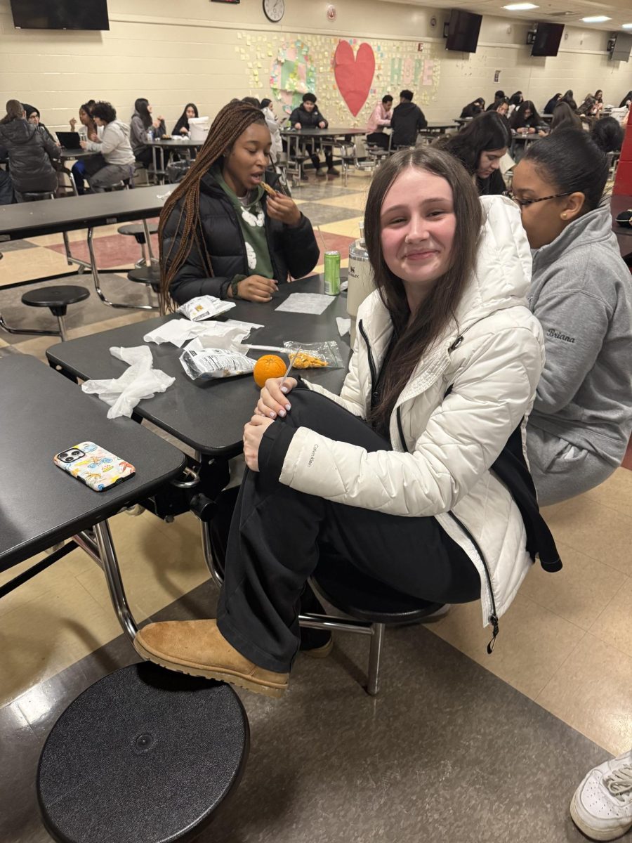 Senior Amelia McNally wearing a pair of UGG mini boots and a Calvin Klein jacket. 