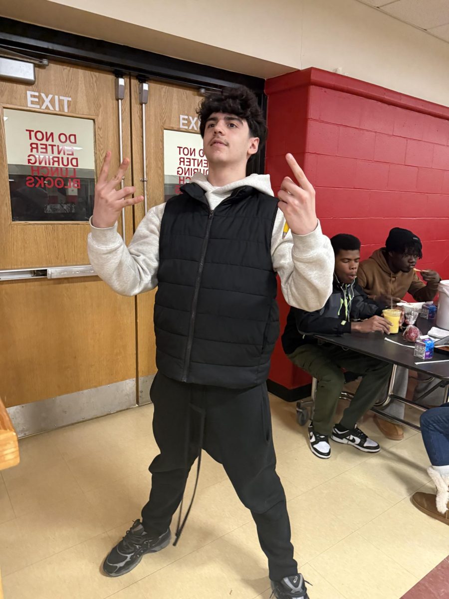 Sophomore Carlos Rodrigues Neto sporting a black Gap vest. 