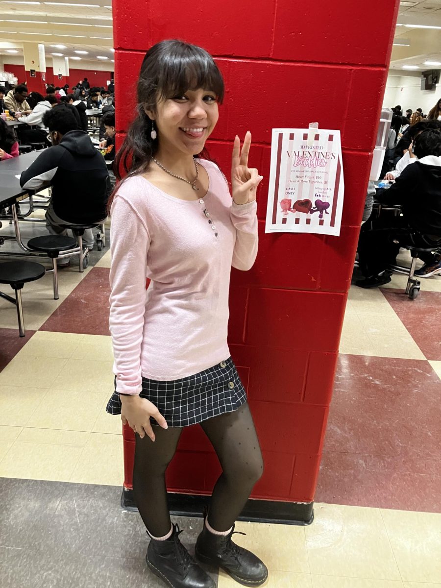 Junior Ananda Damasceno wearing a a light pink long sleeve shirt