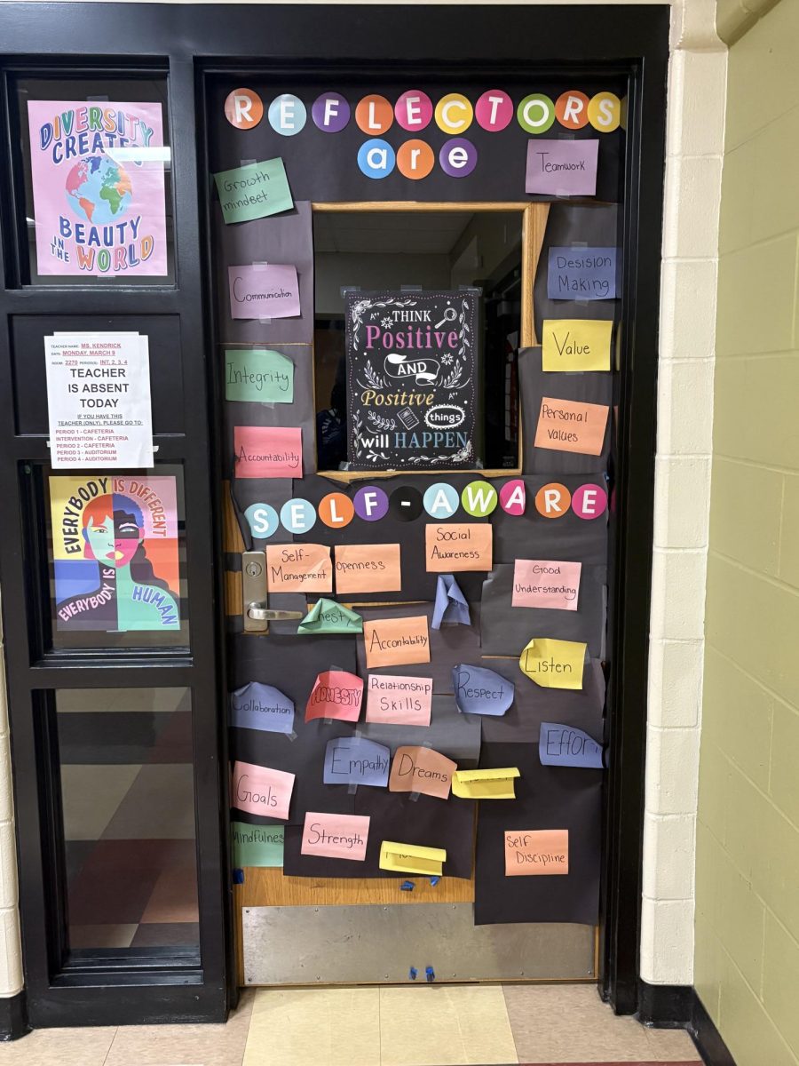 For self-awareness, room 2270 designed an artistic door with sticky notes that all relate to self-awareness.