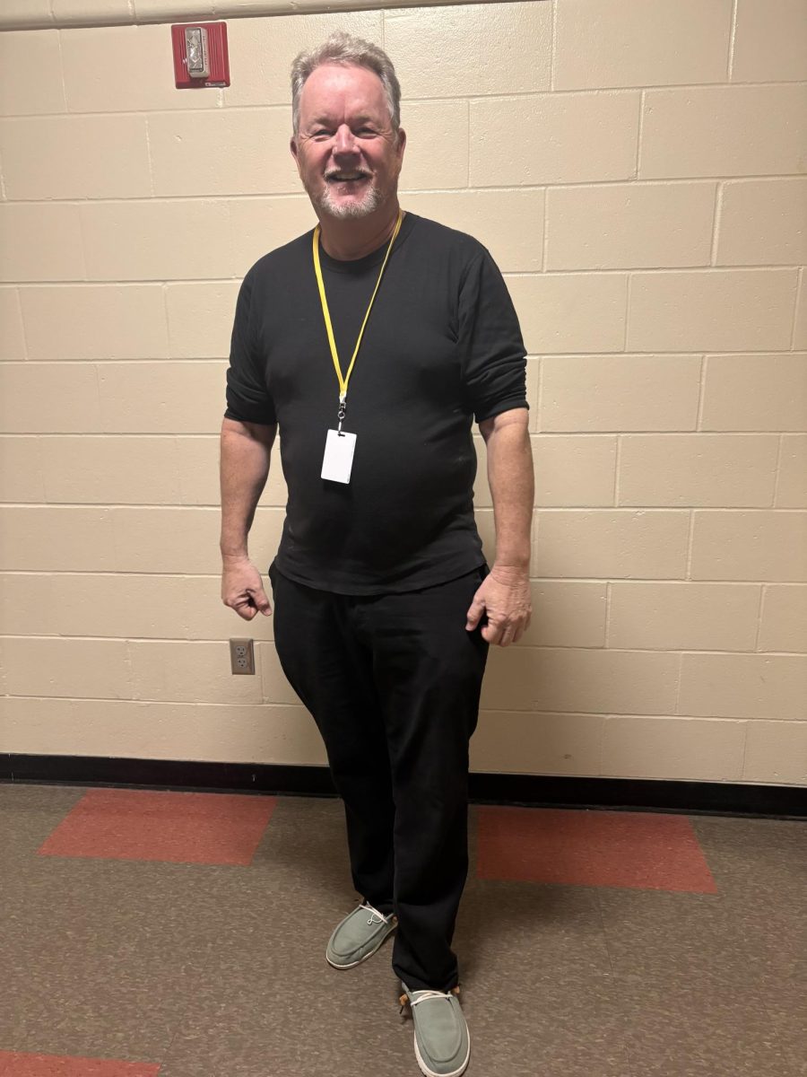 Music Director Gene O'Brien wearing all black clothes from Calvin Klein.