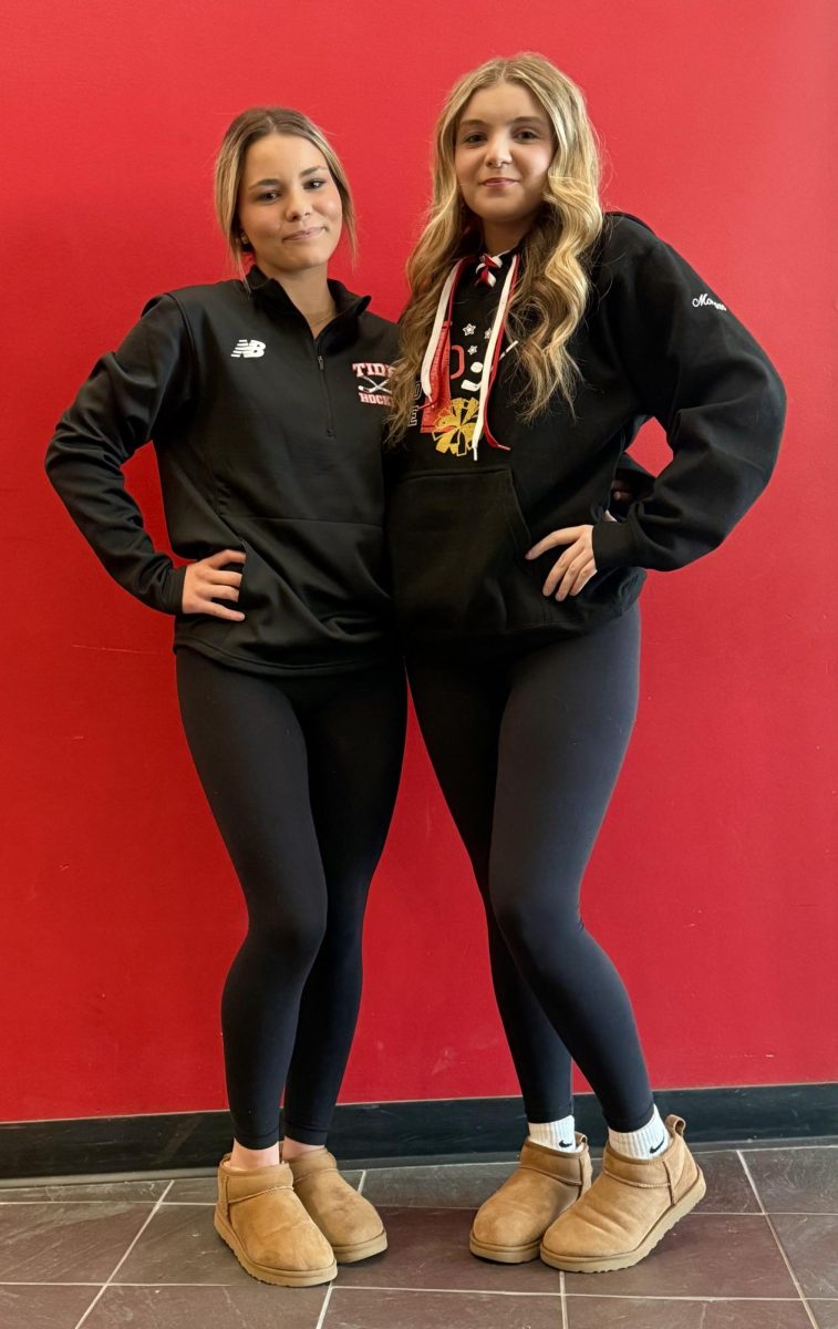 Hockey Player Lindsey Sylva (left) and Hockey Cheerleader Morgan Salvi (right) posing in their all-black sports' merch 