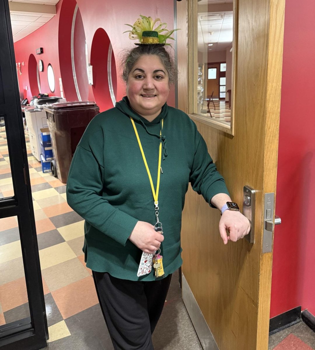 Health Assistance  teacher,Nancy Chaves wearing Saint Patricks Day novelty hat. 