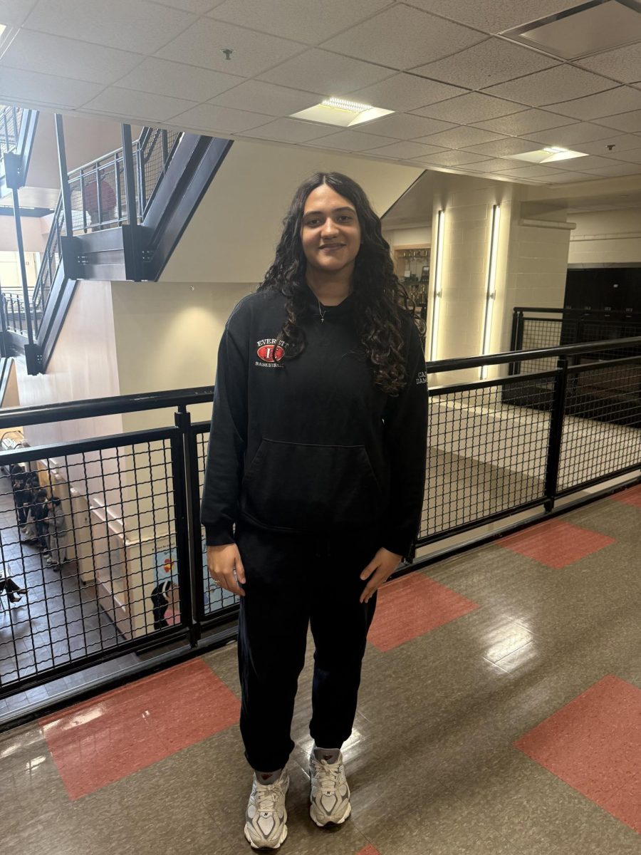 senior Nicole Damaceno wearing EHS basketball tracksuit hoodie.