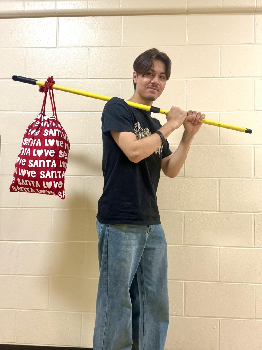 Senior Vinicius Porto with a modern twist on the bindle for Spring Spirit Week’s Anything But A Backpack Day 