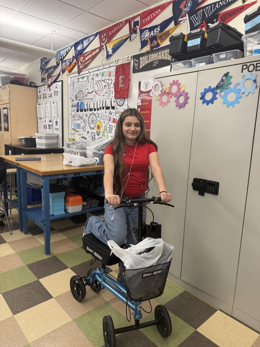 Sophomore Sheila Erazo having a scooter for anything but a backpack.
