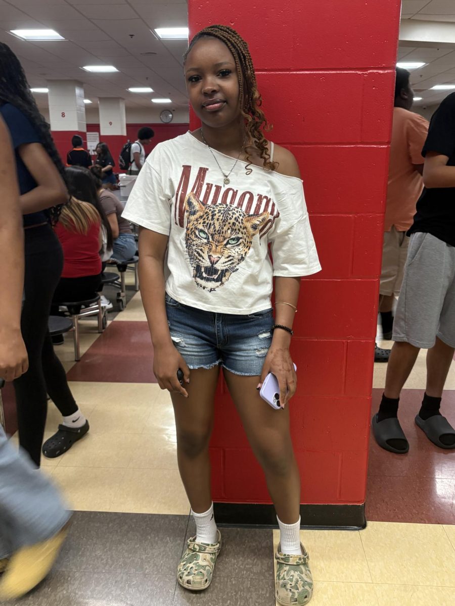A student poses in her summer outfit.