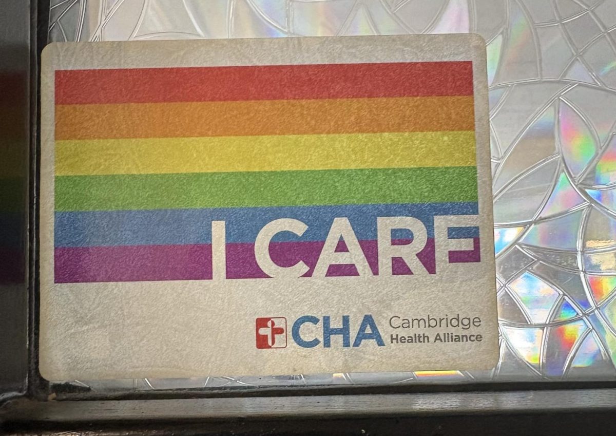 Pride “I CARE” sticker on a classroom door.