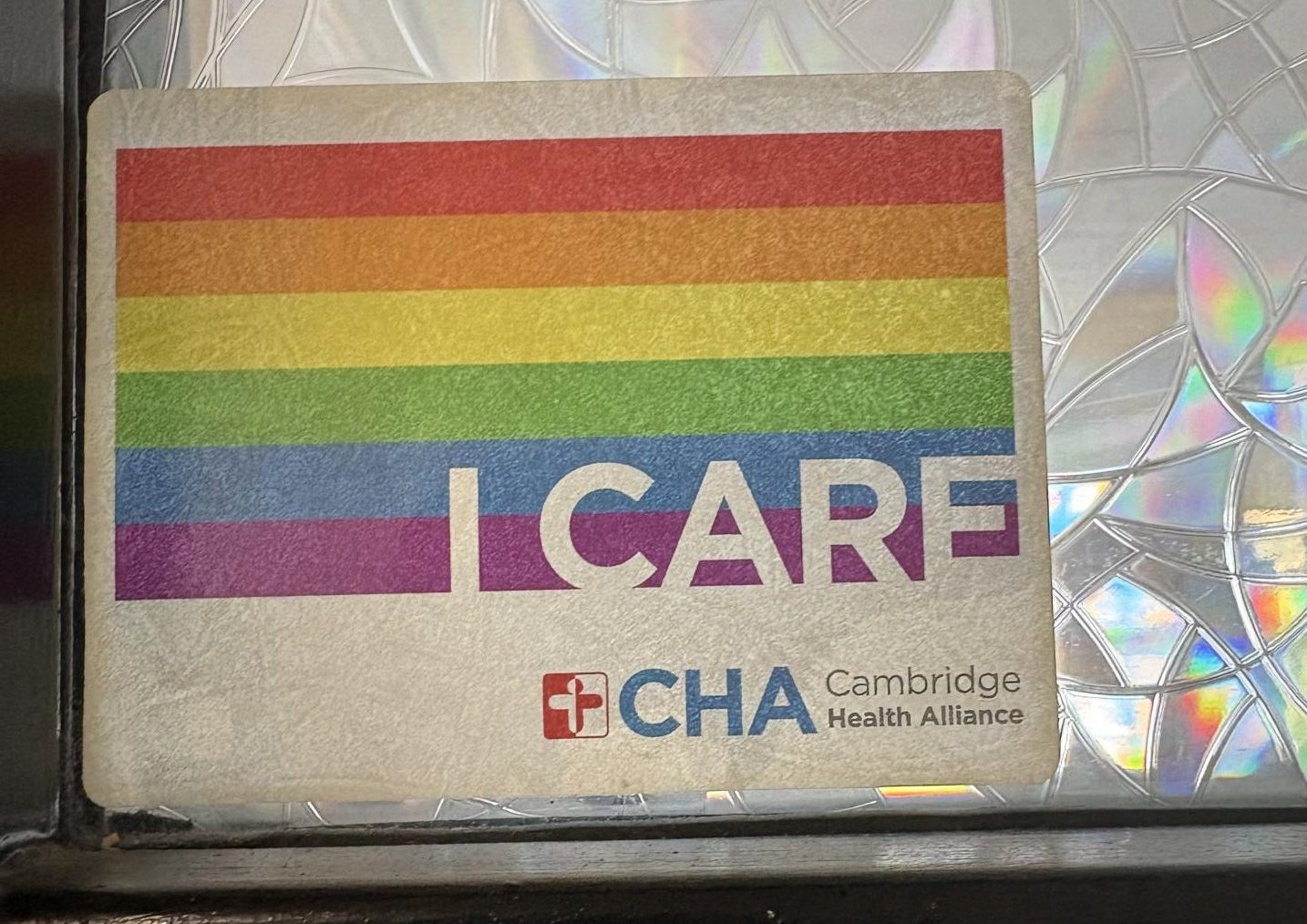 Pride “I CARE” sticker on a classroom door.