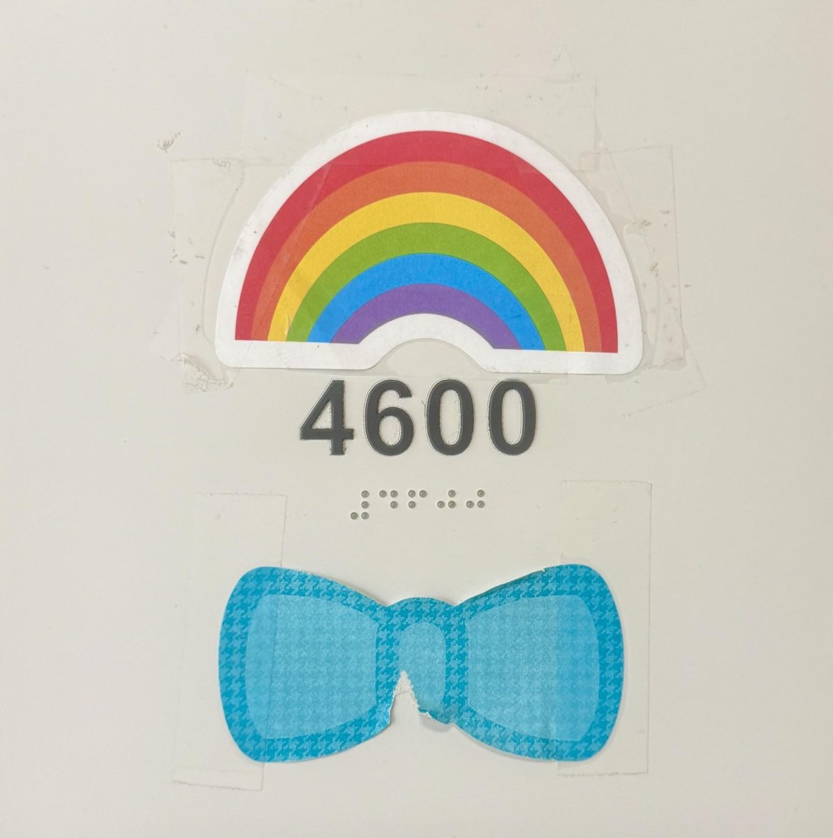 Rainbow and bow tie sticker on the door of Room 4600