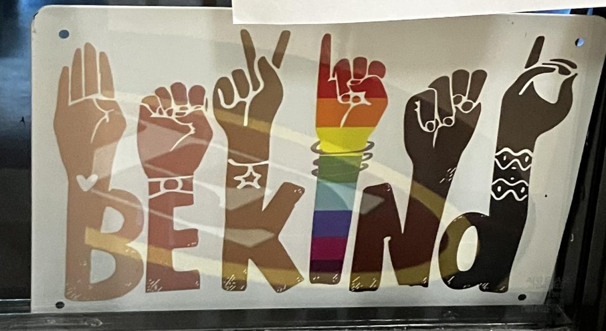 Be Kind sign in the window of 4530